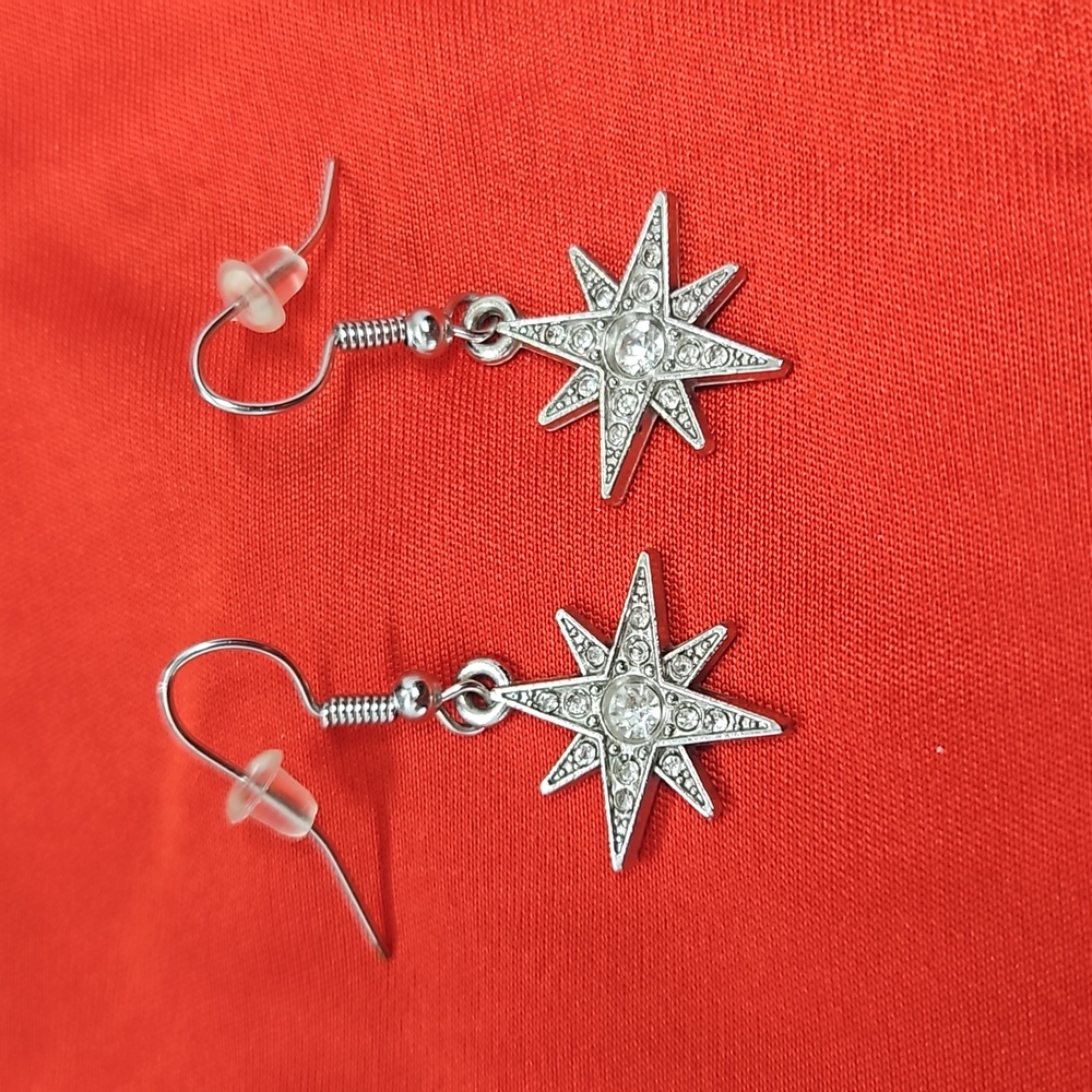 Rhinestone/silver Starburst dangle earrings